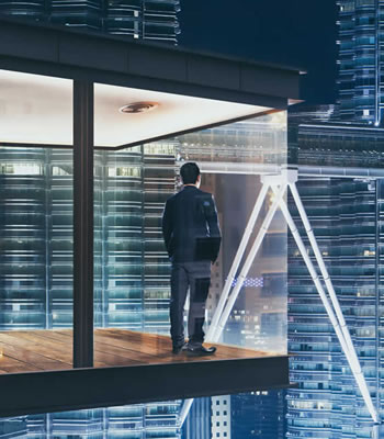 man standing in front of windows