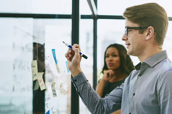 group of people at whiteboard